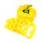 Whole yellow capsicum pepper with sliced cross sections