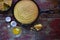 Whole Yellow Cornbread in cast iron skillet with egg shells on rustic wood table closeup top view with copy space