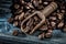Wholegrain coffee beans in scoop on wooden board