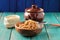 Wholegrain spelt porridge with butter in wooden bowl and raw spelt in linen bag on wooden table