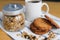 Wholemeal oatmeal cookies stack with granola and coffee on napkin