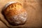 Wholemeal sourdough bread isolated on burlap cloth.