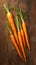 Wholesome snack Fresh baby carrots displayed on a wooden cutting board