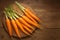 Wholesome snack Fresh baby carrots displayed on a wooden cutting board