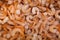 Wholesome and tasty uncooked orange shrimps or prawns background. Harvest of sea. Healthy protein source.