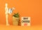 Why choose us symbol. Concept word Why choose us on beautiful wooden block. Businessman model. Beautiful orange table orange