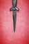 Wiccan dagger on a red background