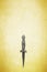 Wiccan dagger on a yellow background