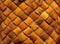 Wicker background from birch bark strips. Natural material. Texture of inner layers of birch bark of different colors
