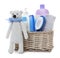 Wicker basket with baby cosmetic products and knitted bear isolated