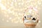 Wicker basket with cosmetics as present against blurred festive lights. Space for text