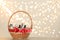 Wicker basket with cosmetics as present against blurred festive lights. Space for text