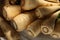 Wicker basket with delicious fresh ripe parsnips on wooden table, above view