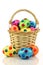 Wicker basket filled with colorful easter eggs