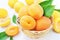 Wicker basket of fresh ripe sweet apricot fruits