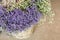 In a wicker basket limonium gmelinii, statice or sea lavender flowers in lavender-blue and white colors in the garden shop