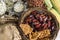 Wicker basket with typical Brazilian foods like pine nuts, popcorn, brown sugar, peanuts and green corn