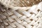 Wicker basket on white background, closeup of photo, soft focus