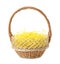 Wicker basket with yellow filler isolated on white. Easter item