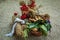 Wicker Baskets Filled with Bread and Sheafs of wheat and Red Flo