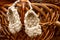 Wicker bast shoes on a wooden basket, Russian amulet