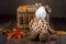 Wicker box with a children`s toy giraffe on a dark background