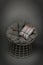 Wicker chair and soft seating and colourful cushion on grey