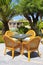 Wicker chairs and palm trees in the mediterranean hotel, Crete,