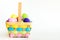 Wicker Easter basket filled with colorful eggs