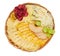 Wicker flat basket with a delicious assortment of cheese, dried orange slices, dried apples, grapes isolated on a white background