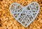 Wicker gray heart large symbol of love wedding on beige background