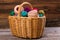 Wicker handmade basket with colored yarn.