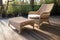 wicker lounge chair and footrest on wooden decking