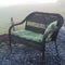 Wicker outdoor loveseat in morning dew