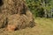 Wicker picnic basket and a haystack - a beautiful rural background in Sunny summer day