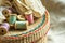 Wicker rattan crafts and sewing supply box, wooden spools, rolls of lace, linen cloth background, hobby fashion concept