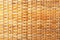 Wicker rattan texture close-up, natural golden texture of wicker rods