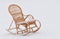 Wicker rocking-chair on the fresh snow