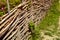 Wicker rustic fence in the garden