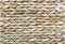 Wicker texture. Background of reed weaving. Rough weaving from straw