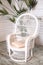 Wicker white armchair in shabby chic interior