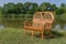 Wicker wide chair on a lakeside