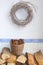 Wicker wreath, pine cones and woodblocks for the fireplace