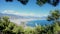 Wide angle aerial drone pan shot of Alanya city harbor with ships on a famous touristic beach against mountain landscape during