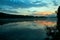 Wide-angle lake in the morning, sunrise after the mountain