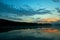 Wide-angle lake in the morning, sunrise after the mountain