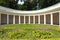 Wide-angle landscape view of decorative architectural building called Echo colonnade on a sunny summer day.