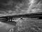 Wide angle monochrome image, concrete bridge over Olt river