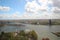 Wide angle overview at 100 metres height over the Rotterdam Skyline with blue sky and white rain clouds