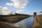 Wide angle overview of a koploper ICM intercity train on the track fron the hague heading to Gouda.